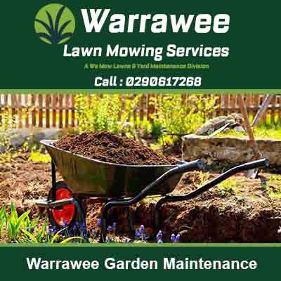 Wheelbarrow filled with dark soil or compost in Warrawee