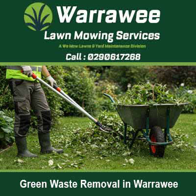 Worker loading green waste into wheelbarrow in Warrawee